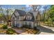 Traditional two-story home with a side entry two-car garage and a manicured lawn at 3139 Players Dr, Jonesboro, GA 30236