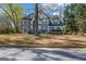 Charming two-story home with neutral siding, trimmed windows, mature landscaping, and a classic architectural style at 3139 Players Dr, Jonesboro, GA 30236