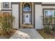 A classic white front door framed by columns and a charming wreath welcomes you to the home at 3139 Players Dr, Jonesboro, GA 30236