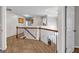 Upstairs hallway with hardwood floors and wrought iron railing at 3139 Players Dr, Jonesboro, GA 30236