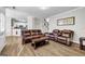 Spacious living room features two leather sofas and hardwood flooring at 3139 Players Dr, Jonesboro, GA 30236