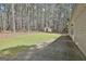 Spacious backyard with grassy area, mature trees, and a small storage shed at 1109 Allen Rd, Grantville, GA 30220