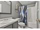 Gray bathroom featuring a single sink vanity, and a shower with a patterned curtain at 1109 Allen Rd, Grantville, GA 30220