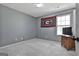 Bedroom with carpet, a window, neutral walls, and a closet for storage at 1109 Allen Rd, Grantville, GA 30220