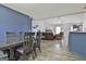 Open concept living room with vaulted ceiling, a ceiling fan, wood floors and modern furniture at 1109 Allen Rd, Grantville, GA 30220