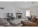 Comfortable living room featuring a fireplace, entertainment center, and inviting ambiance at 1109 Allen Rd, Grantville, GA 30220