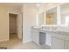 Bright bathroom with granite countertop, double sinks, and tile floors at 502 Alford Cv # 91, Fairburn, GA 30213