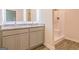 Bathroom with double vanity, granite countertops, illuminated mirrors, and a stand-up shower at 502 Alford Cv # 91, Fairburn, GA 30213