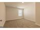 Spacious bedroom with neutral walls, carpet flooring, and natural light at 502 Alford Cv # 91, Fairburn, GA 30213