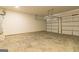 A large garage featuring two car garage doors and a concrete floor at 502 Alford Cv # 91, Fairburn, GA 30213