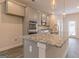 Gourmet kitchen with island, stainless steel appliances, granite countertops, and pendant lighting at 502 Alford Cv # 91, Fairburn, GA 30213