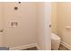 Laundry room with washer/dryer hookups and a sleek, water-saving toilet at 502 Alford Cv # 91, Fairburn, GA 30213