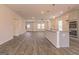 Open-concept living space with wood-look flooring, recessed lighting, and a kitchen island at 502 Alford Cv # 91, Fairburn, GA 30213
