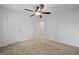 Bedroom featuring neutral carpet, and two closets at 385 Lakeshore Dr, Stockbridge, GA 30281
