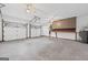 Spacious garage featuring white doors, storage and concrete floor at 385 Lakeshore Dr, Stockbridge, GA 30281