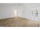 Spacious, bright living room with a vaulted ceiling, neutral carpet, and an open layout at 385 Lakeshore Dr, Stockbridge, GA 30281