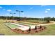 Community bocce ball courts are surrounded by landscaped grounds at 591 Parnassus Rd, Locust Grove, GA 30248