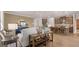 Open-concept living space featuring hardwood floors and a seamless connection to the kitchen at 591 Parnassus Rd, Locust Grove, GA 30248