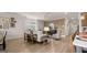 Open-concept living space featuring modern decor, hardwood floors, and a seamless flow to the kitchen at 591 Parnassus Rd, Locust Grove, GA 30248