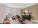 Inviting living room with a neutral color scheme and views of the outdoors at 591 Parnassus Rd, Locust Grove, GA 30248