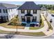 Two-story home with black shutters, elegant landscaping, and a well-manicured lawn at 1461 Thomas St, Conyers, GA 30094