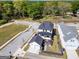 Aerial view of house, two-car garage, black pergola, backyard and surrounding neighborhood at 1461 Thomas St, Conyers, GA 30094