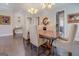 Dining room with hardwood floors, chandelier, and views into other living spaces at 1461 Thomas St, Conyers, GA 30094