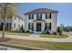 Charming two-story home featuring a landscaped front yard with a stylish entry and black shutters at 1461 Thomas St, Conyers, GA 30094