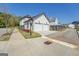 Side view of a two car garage, sidewalk and manicured landscaping at 1461 Thomas St, Conyers, GA 30094