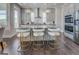 Modern kitchen with stainless steel appliances, a large island, and pendant lighting at 1461 Thomas St, Conyers, GA 30094