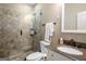 Modern bathroom featuring a tiled shower and granite countertop with a sink at 240 Trotters Rdg, Fayetteville, GA 30215