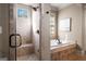Well-designed bathroom with a tiled shower, soaking tub, and neutral color palette at 240 Trotters Rdg, Fayetteville, GA 30215