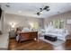Comfortable bedroom features a sitting area, desk, and bright natural light from the windows at 240 Trotters Rdg, Fayetteville, GA 30215