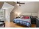 Cozy bedroom features hardwood floors, ceiling fan, and a window with natural light at 240 Trotters Rdg, Fayetteville, GA 30215