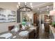 Formal dining room featuring rustic table setting, unique chandelier and neutral wall colors at 240 Trotters Rdg, Fayetteville, GA 30215