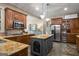 Gourmet kitchen with granite countertops, stainless steel appliances, island and custom cabinetry at 240 Trotters Rdg, Fayetteville, GA 30215