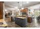Open concept kitchen featuring granite countertops, center island and stainless steel appliances at 240 Trotters Rdg, Fayetteville, GA 30215