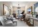 Cozy living room with piano, neutral walls, chandelier, and a large window at 240 Trotters Rdg, Fayetteville, GA 30215