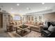 Spacious living area with a large sectional sofa, recessed lighting, and french doors to the backyard at 240 Trotters Rdg, Fayetteville, GA 30215