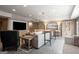 Relaxing living room featuring a large screen tv, comfortable seating, and built in cabinets for storage at 240 Trotters Rdg, Fayetteville, GA 30215