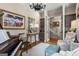 Elegant living room with hardwood floors, piano, a chandelier, and neutral walls at 240 Trotters Rdg, Fayetteville, GA 30215