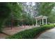 Community playground with swing set and gazebo surrounded by green trees and bushes at 240 Trotters Rdg, Fayetteville, GA 30215