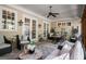 Covered porch with a ceiling fan, furniture, outdoor seating and a dining table at 240 Trotters Rdg, Fayetteville, GA 30215