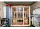 Sauna in a basement gym with glass door and wood accents at 240 Trotters Rdg, Fayetteville, GA 30215