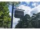 Highgrove neighborhood sign with black and gold colors surrounded by mature trees at 240 Trotters Rdg, Fayetteville, GA 30215