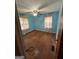 This bedroom offers natural light and original hardwood flooring at 2980 Catalina Dr, Decatur, GA 30032