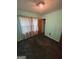 The bedroom features wood-paneled walls, a window, and a closet at 2980 Catalina Dr, Decatur, GA 30032