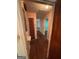 Hallway showing access to multiple rooms with original hardwood flooring at 2980 Catalina Dr, Decatur, GA 30032