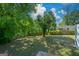 Expansive backyard with a well-maintained lawn and a wooden fence offers a private outdoor space at 3164 Harris Dr, East Point, GA 30344