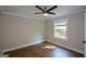 Bedroom with wood floors, natural light, and ceiling fan at 3164 Harris Dr, East Point, GA 30344